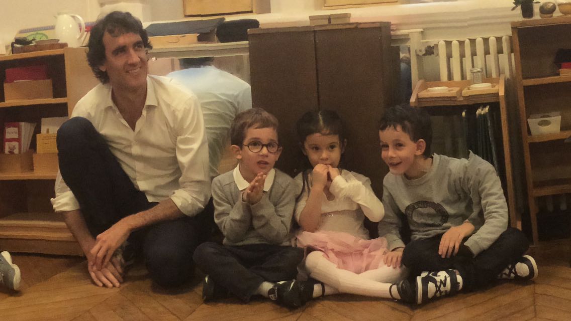 Laurent with children in the classroom